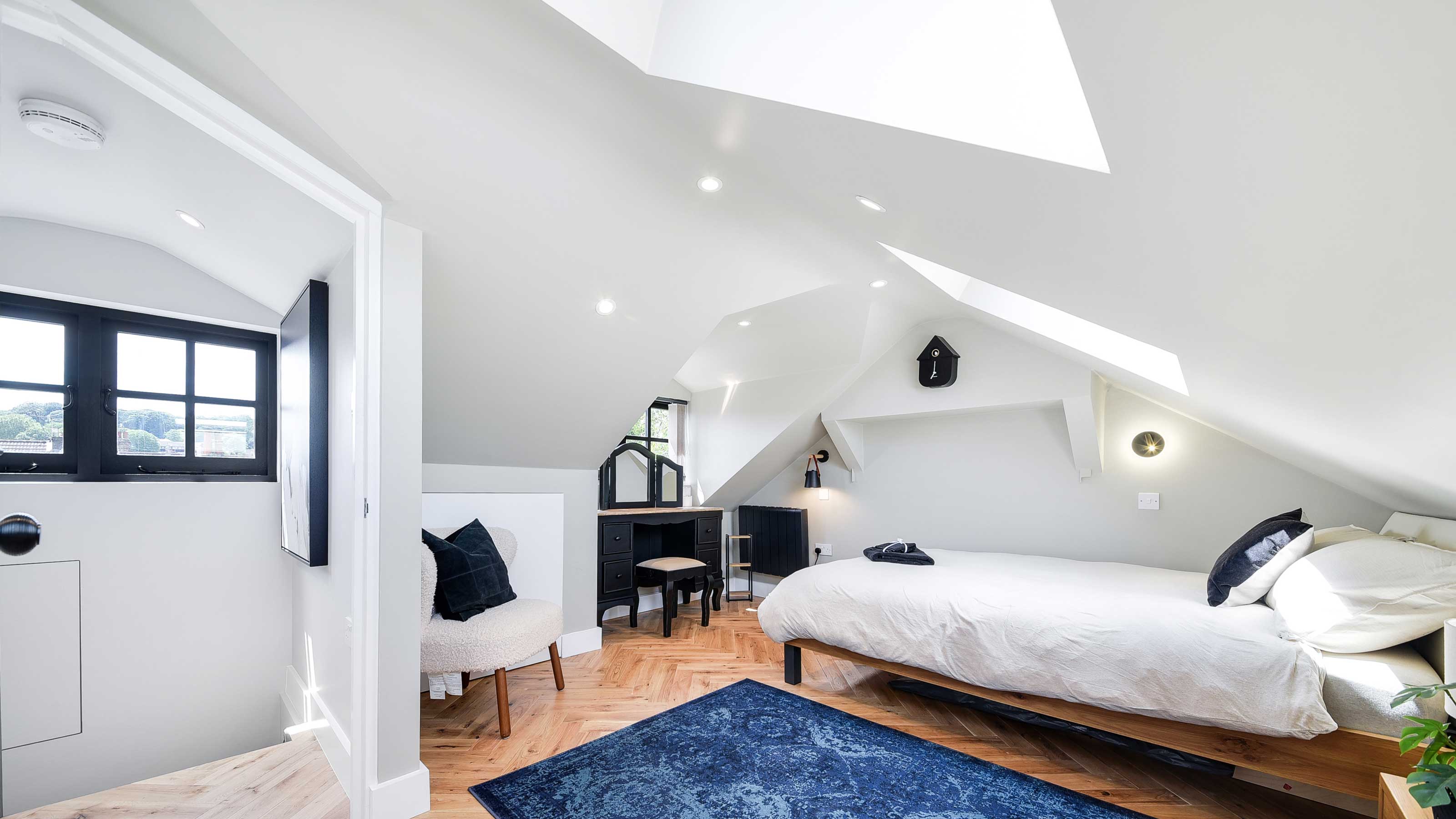 loft conversion bedroom with herringbone flooring