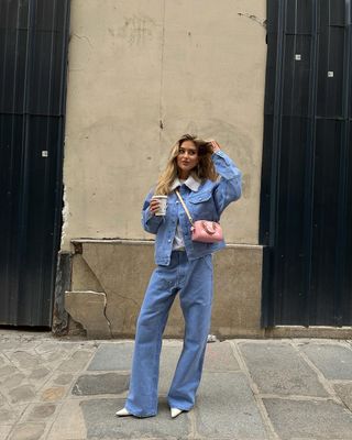 Denim on denim outfit with pink purse