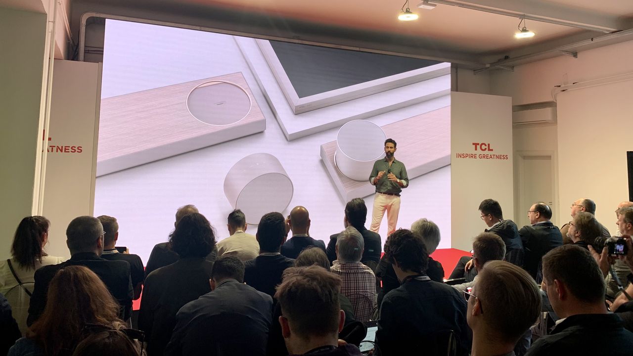 TCL Art TV's soundbar on a projection, onstage at Milan Design Week