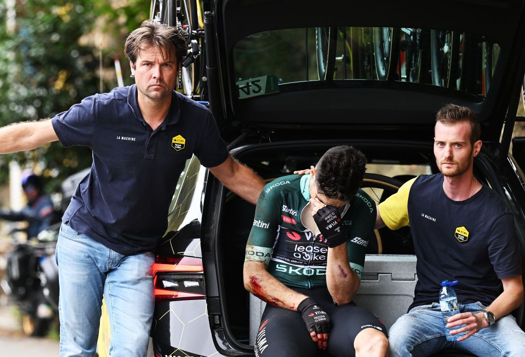 LAGOS DE COVADONGA SPAIN SEPTEMBER 03 EDITORS NOTE Image depicts graphic content Wout van Aert of Belgium and Team Visma Lease a Bike Green Points Jersey reacts after the fall and abandons the race accompanied by the sporting director Addy Engels during the La Vuelta 79th Tour of Spain 2024 Stage 16 a 1815km stage Luanco to Lagos de Covadonga 1069m UCIWT on September 03 2024 in Lagos de Covadonga Spain Photo by Tim de WaeleGetty Images