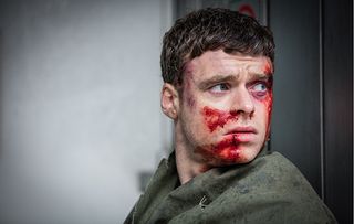 Richard Madden covered in blood as David Budd in the final episode of Bodyguard