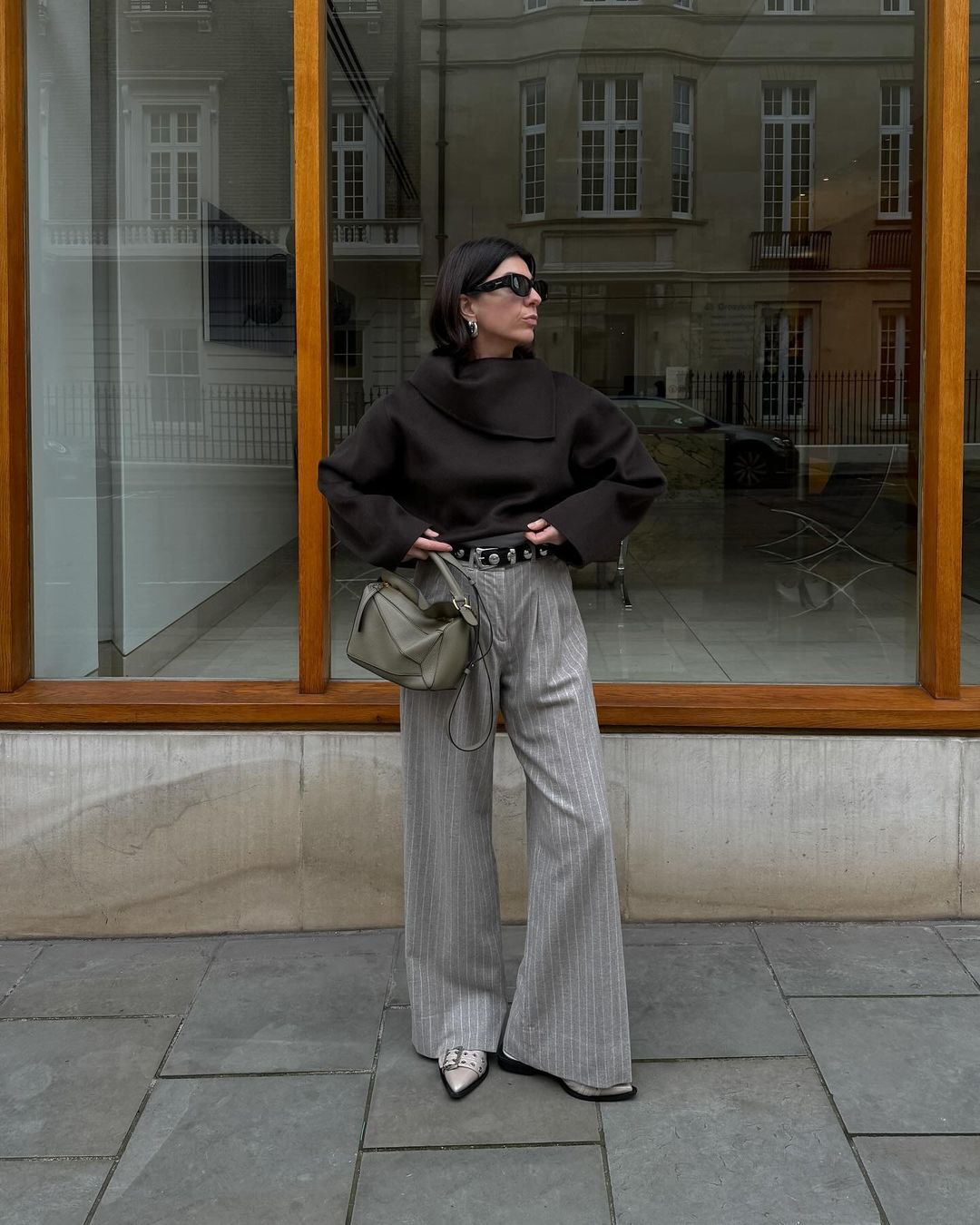 Francesca Saffari wearing wide leg trousers an Ganni flats