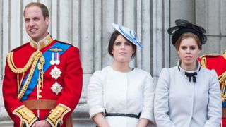 Prince William, Duke of Cambridge, Princess Eugenie and Princess Beatrice stand on the balcony