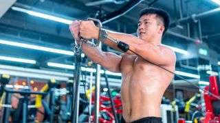 Man using cable machine to perform a chest exercise