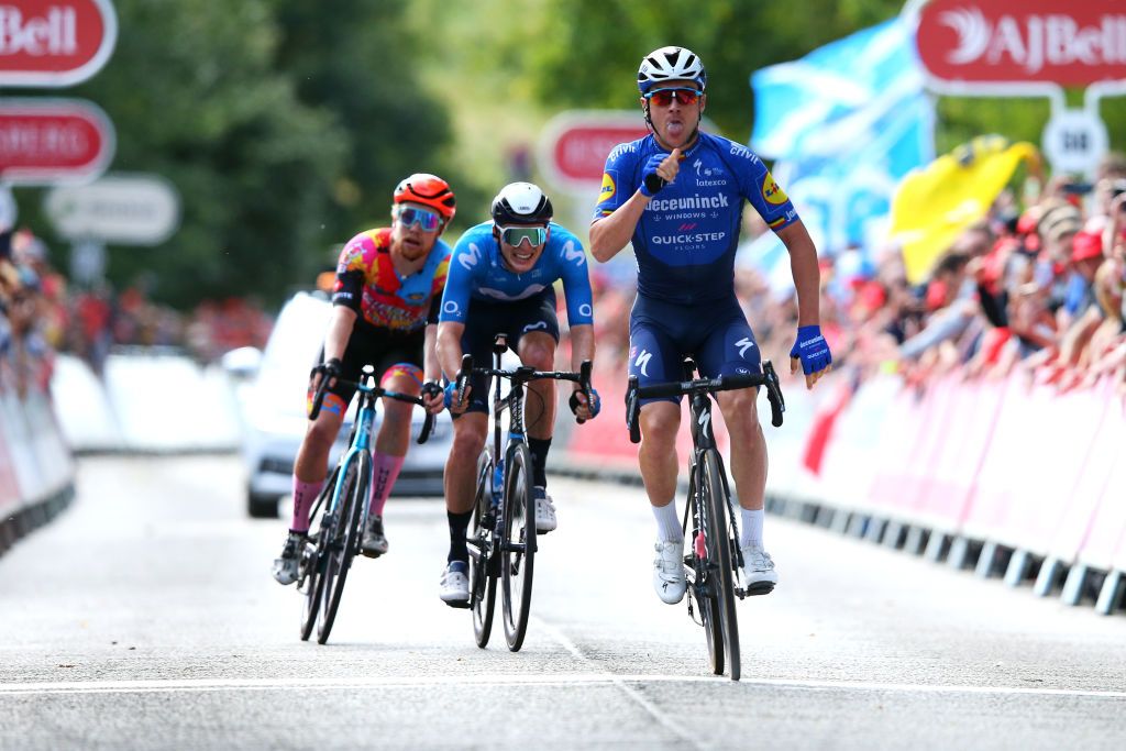 EDINBURGH SCOTLAND SEPTEMBER 11 Yves Lampaert of Belgium and Team Deceuninck QuickStep celebrates at finish line as stage winner ahead of Matteo Jorgenson of United States and Movistar Team and Matthew Gibson of United Kingdom and Team Ribble Weldtite Pro Cycling during the 17th Tour of Britain 2021 Stage 7 a 1948km stage from Hawick to Edinburgh TourofBritain TourofBritain on September 11 2021 in Edinburgh Scotland Photo by Alex LiveseyGetty Images