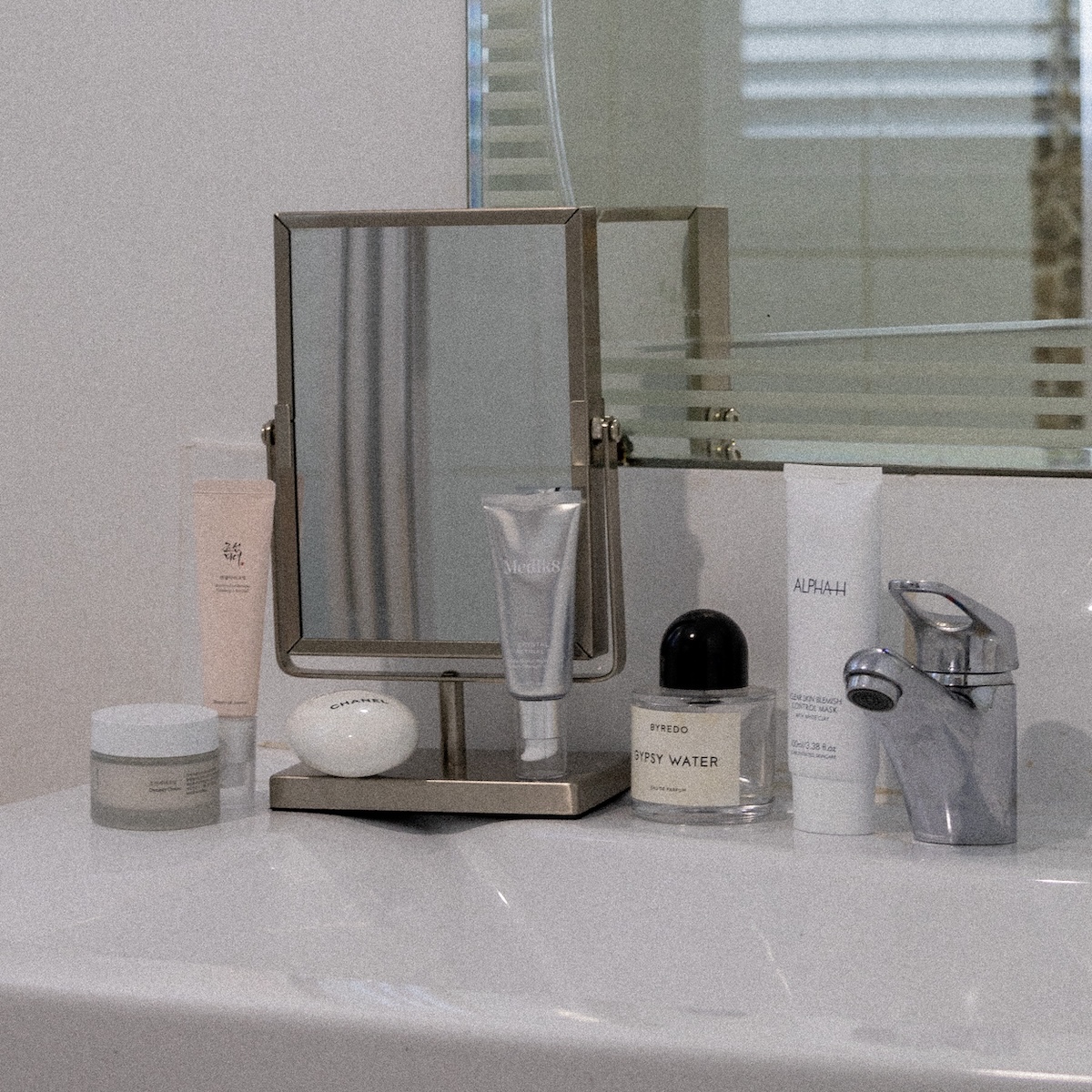 Bathroom sink with beauty products