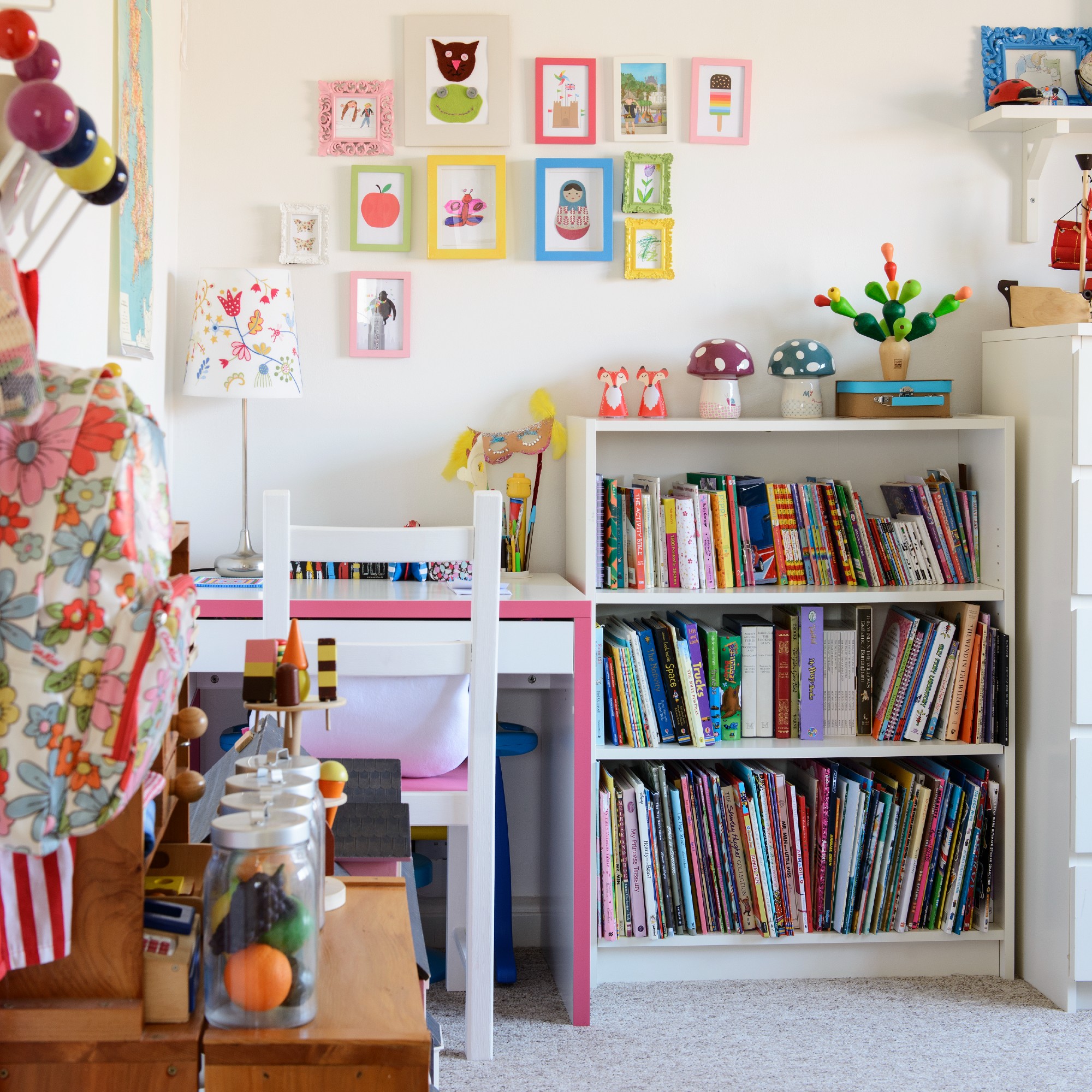 A kid's room with a bookshelf and a desk
