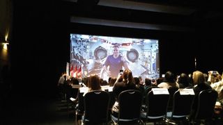 Canadian astronaut David Saint-Jacques (on screen) calls down from the International Space Station to a group of schoolchildren at the Canada Aviation and Space Museum in Ottawa on Feb. 7, 2019.