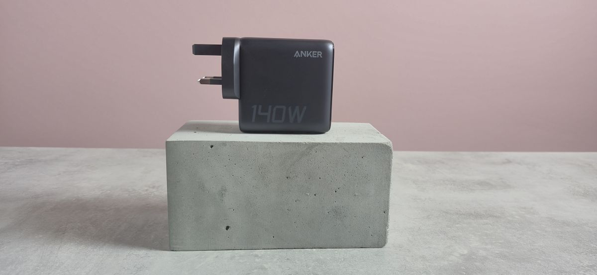 Anker Charger 140W, 4-Port, PD 3.1 on block against pink background