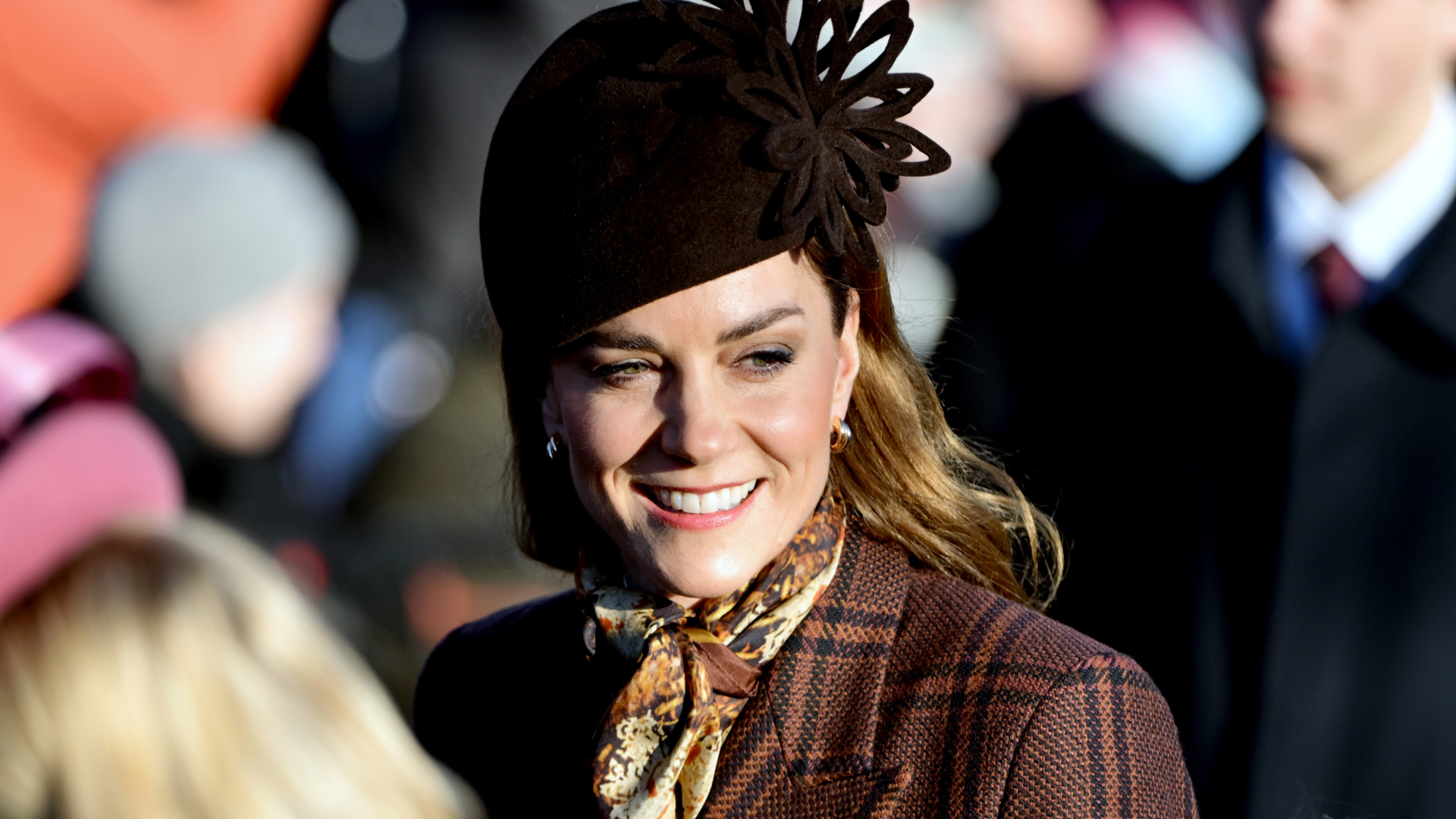Princess Kate wearing a brown coat and hat on christmas 2025