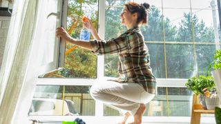 woman cleaning windows 