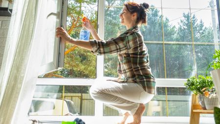 woman cleaning windows 