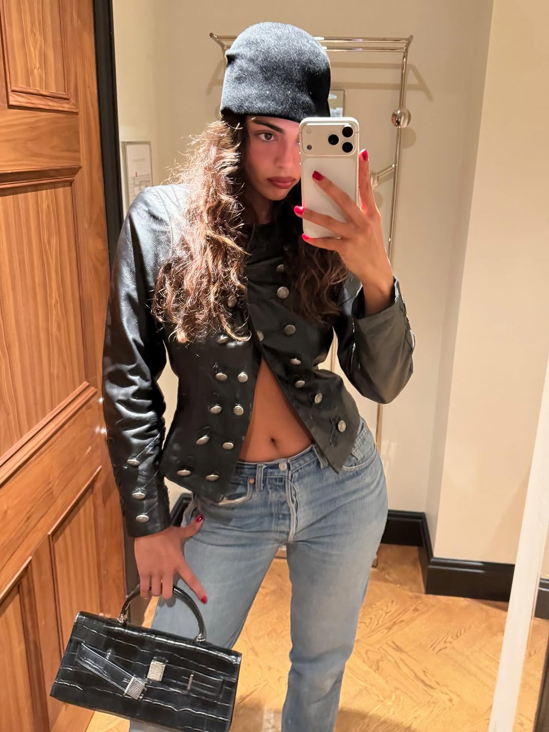 woman wearing winter to spring transitional jacket trends 2026