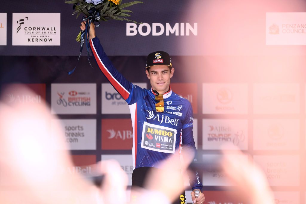 BODMIN ENGLAND SEPTEMBER 05 Wout Van Aert of Belgium and Team Jumbo Visma celebrates winning the blue leader jersey on the podium ceremony after the 17th Tour of Britain 2021 Stage 1 a 1808km stage from Penzance to Bodmin TourofBritain TourofBritain on September 05 2021 in Bodmin England Photo by Harry TrumpGetty Images