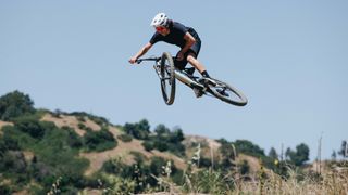 A man doing an air on a mountain bike