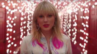 Taylor Swift in Lover music video 2019 with pink highlights