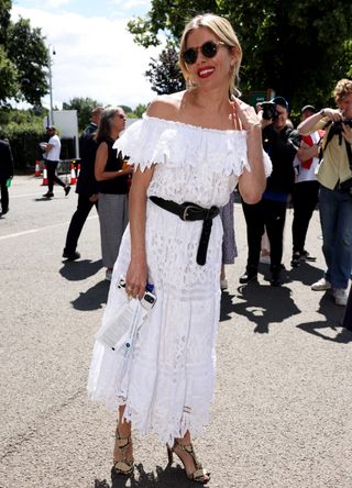 Sienna Miller wearing a lace off-the-shoulder dress at Wimbledon 2022