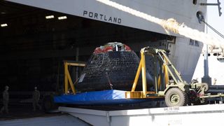 NASA's Artemis 1 Orion capsule is moved to dry land and out of the U.S. Navy's USS Portland recovery ship in San Diego, California on Dec. 14, 2022.