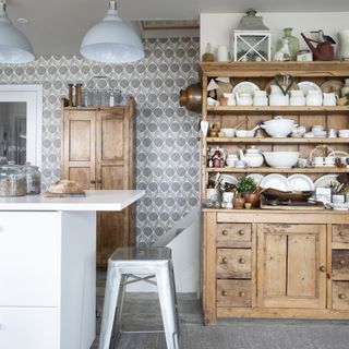 vintage dresser in contemporary white kitchen