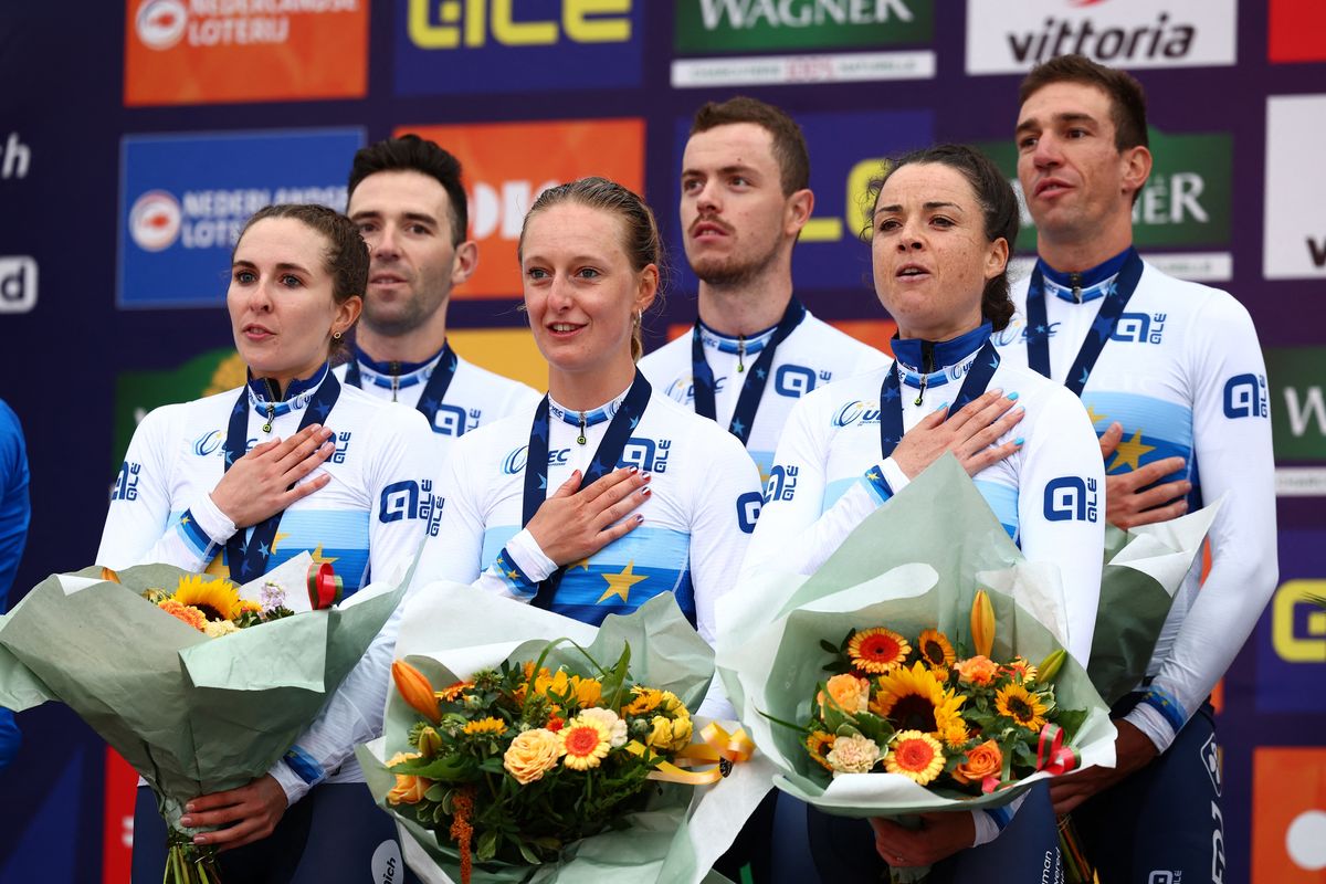 The French mixed relay TTT team celebrate their victory with the national anthem