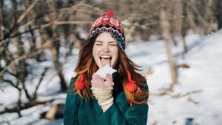 woman licking snow