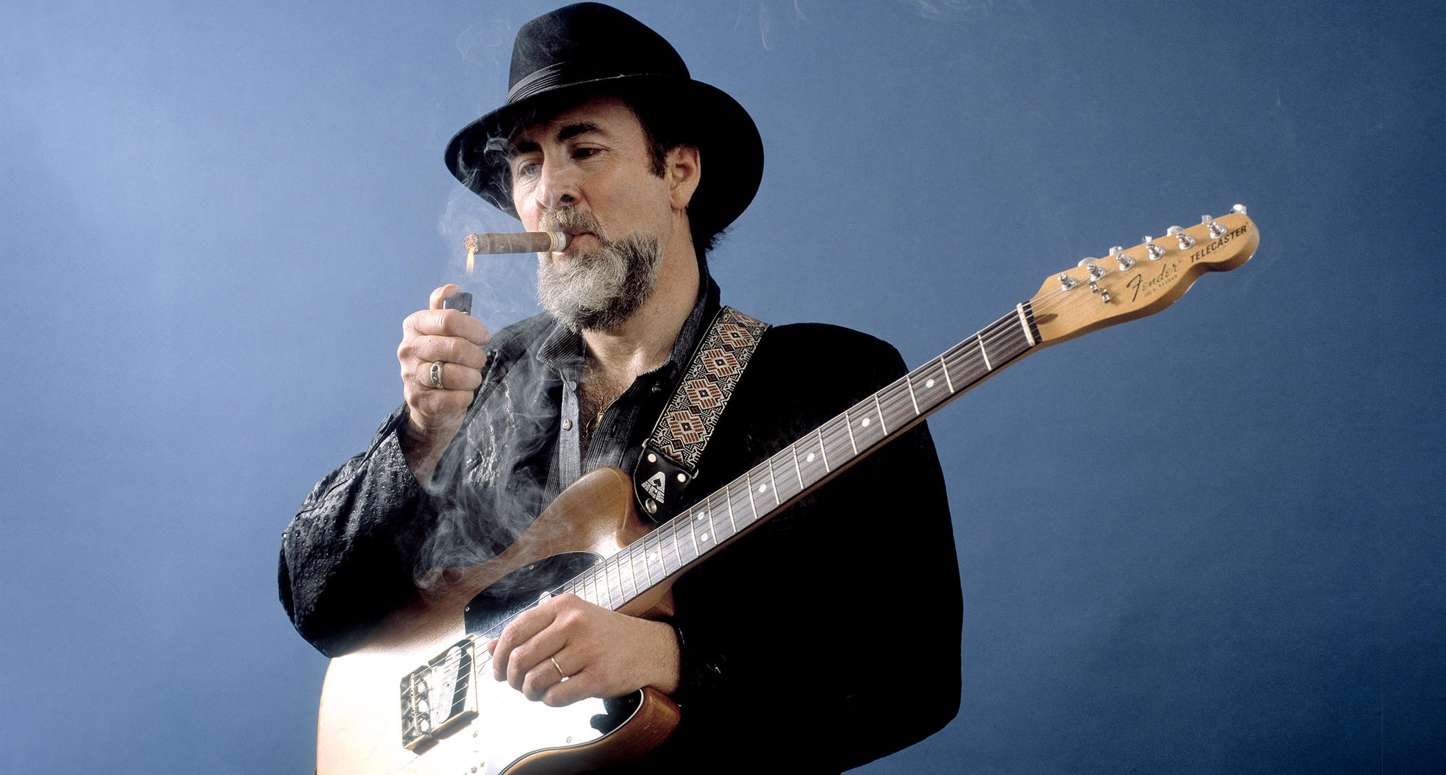 Roy Buchanan lights a cigar 