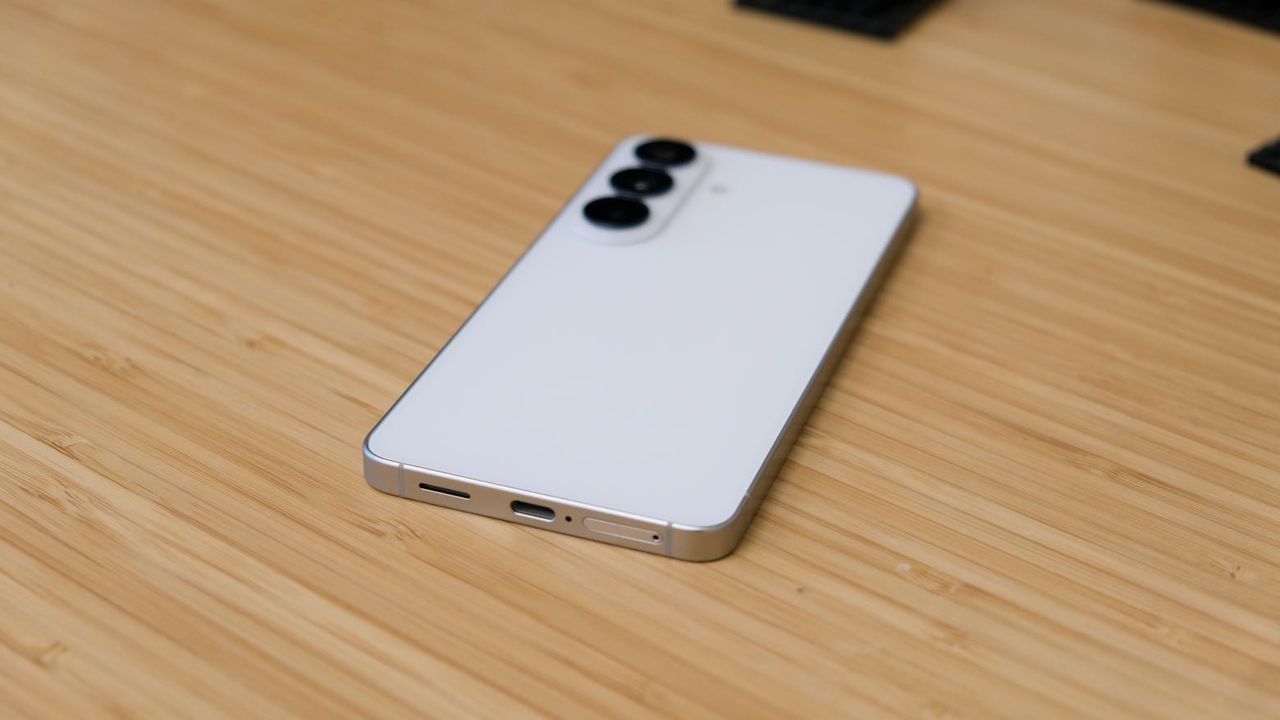 The Samsung Galaxy S26 resting on a wooden table