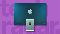 An Apple iMac, one of our picks for the best computer, seen from the back against a pink background.