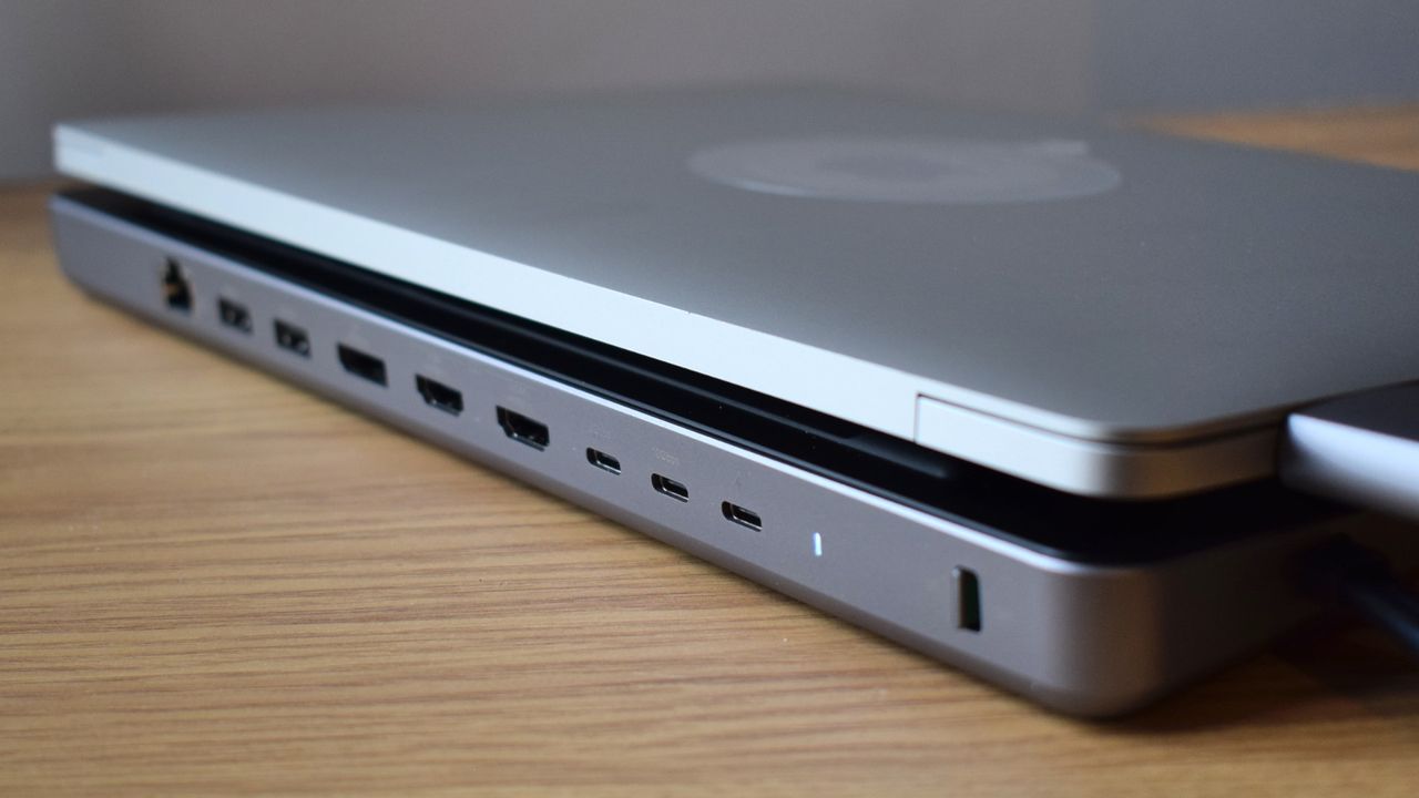 An image of a MacBook Air on top of the Satechi Dual Dock Stand from behind, showing its rear port selection, power light, and on-off switch.