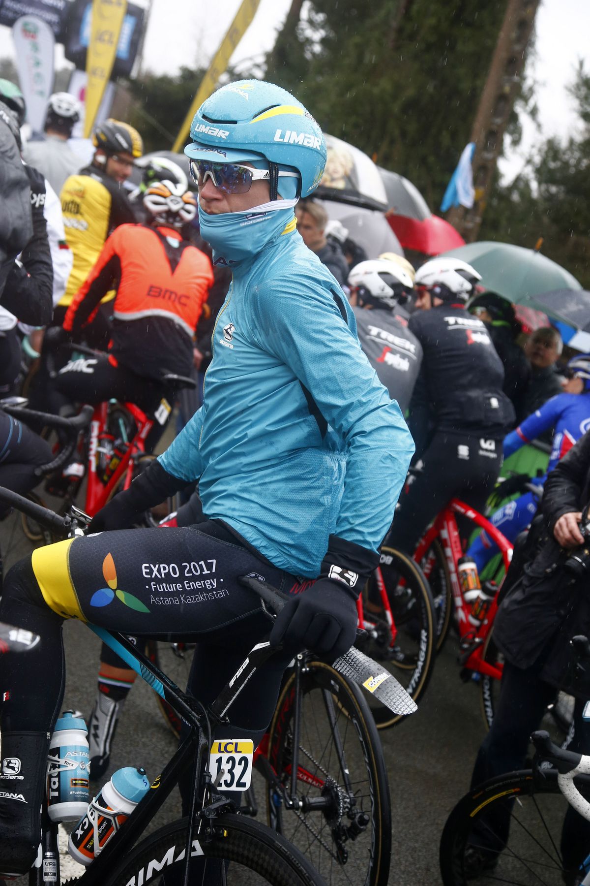Riders bundled up on a cold, rainy Paris-Nice stage