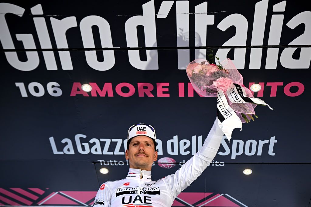 VAL DI ZOLDO PALAFAVERA ITALY MAY 25 Joo Almeida of Portugal and UAE Team Emirates White Best Young Rider Jersey celebrates at podium during the 106th Giro dItalia 2023 Stage 18 a 161km stage from Oderzo to Val di Zoldo Palafavera 1514m UCIWT on May 25 2023 in Val di Zoldo Palafavera Italy Photo by Stuart FranklinGetty Images