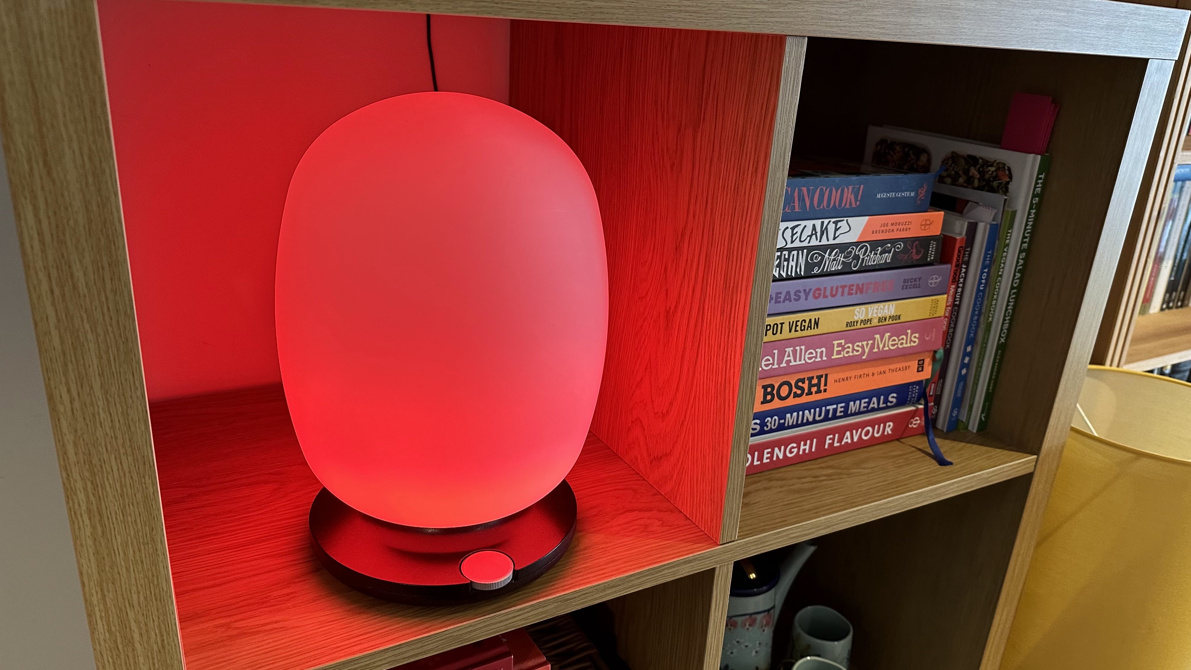 The SkyView 2 connected lamp on a wooden bookshelf
