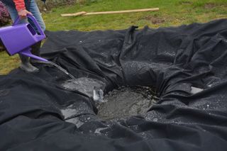 Pond liner added to a pond and being filled with water for the first time