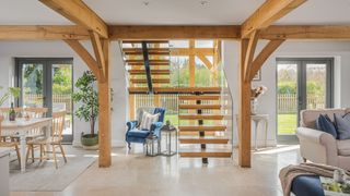 oak and glass staircase in open plan oak home