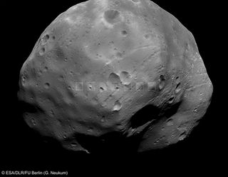 In this picture, seven close-up views of Phobos, taken by the Super Resolution Channel on the High Resolution Stereo Camera, are superimposed on the wider view.