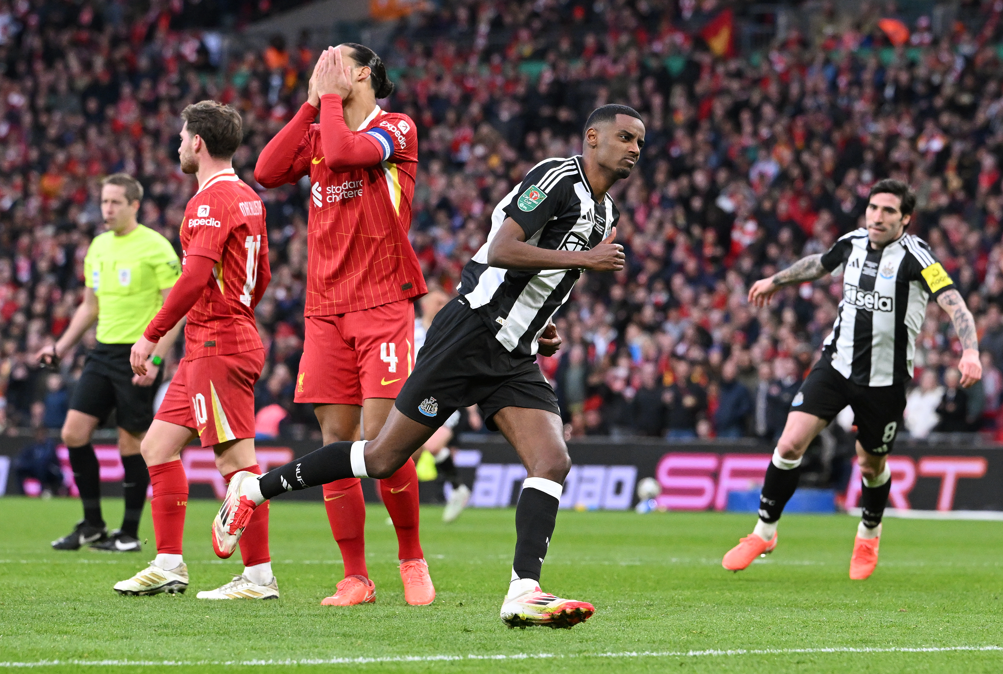 Alexander Isak scores past Virgil van Dijk in the Carabao Cup Final