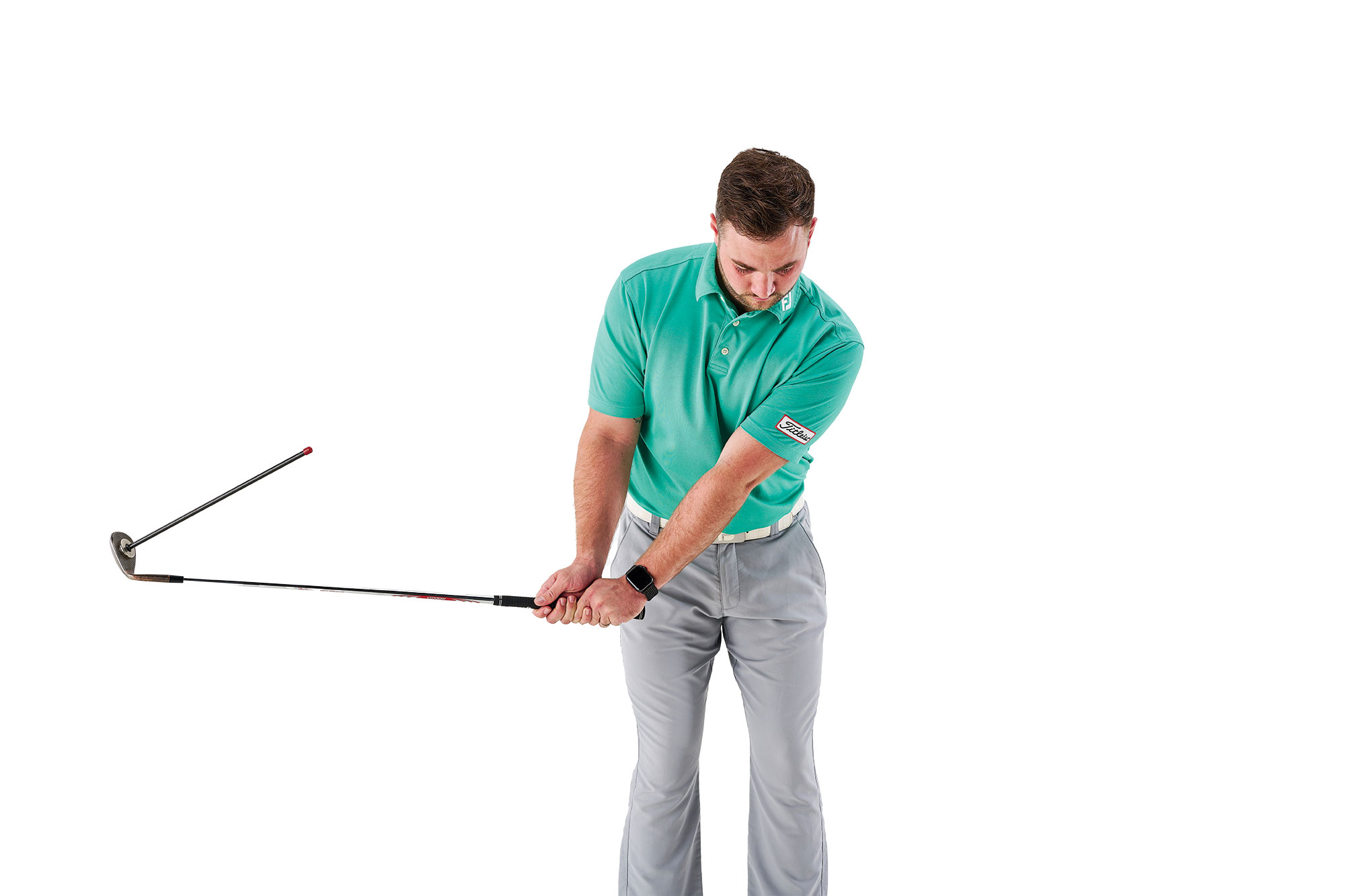 Joshua Mayo at halfway back in the backswing to demonstrate the appropriate length of swing for the pop chip shot around the green