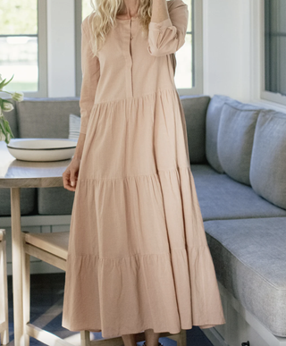 a model wears the jenni kayne James Dress in a living room