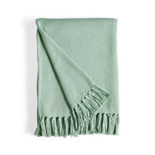 a green folded throw from dunelm