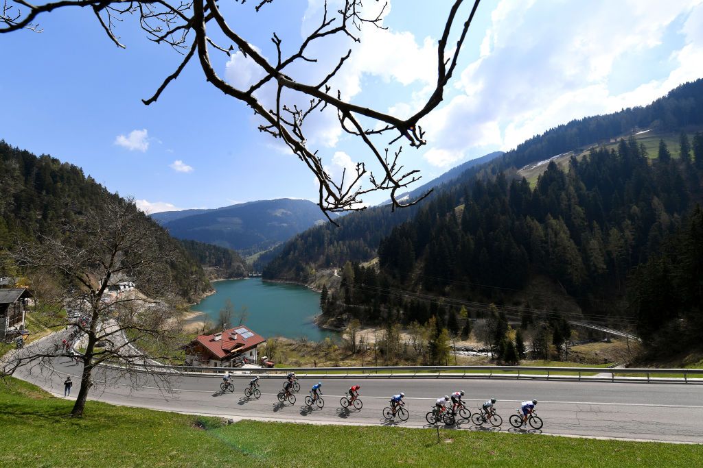 PIEVEDIBONO ITALY APRIL 22 The peloton passing through UltentalVal dUltimo mountain 931m landscape during the 44th Tour of the Alps 2021 Stage 4 a 1686 to stage from Naturns to Valle del Chiese Pieve di Bono TourofTheAlps Lake Forest TouroftheAlps on April 22 2021 in Pieve di Bono Italy Photo by Tim de WaeleGetty Images