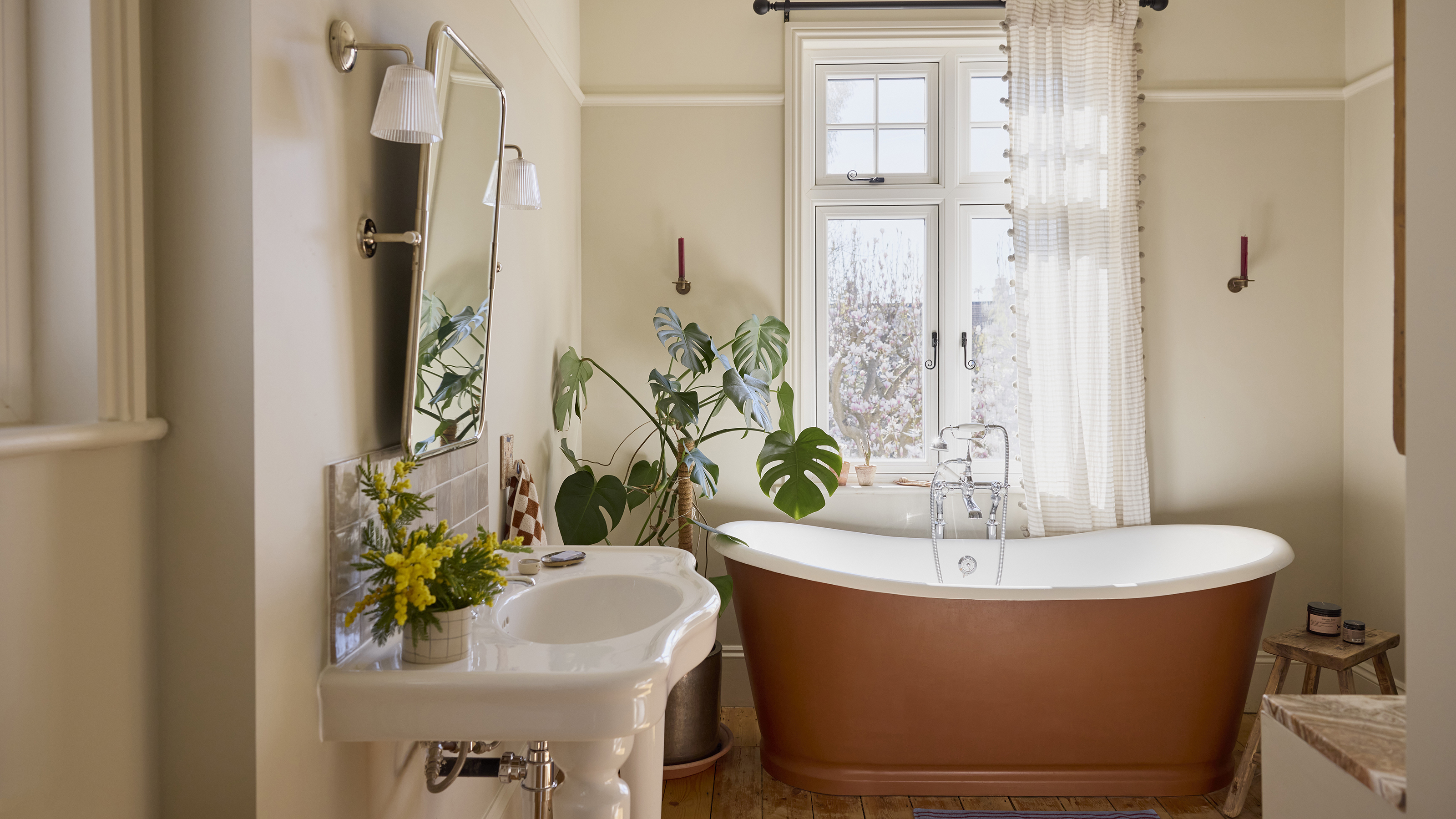 simple neutral bathroom with terracotta bath