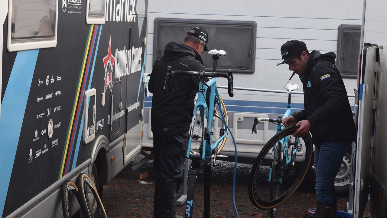Mechanics from the Marlux-Napolean Games clean bikes after some warm up laps