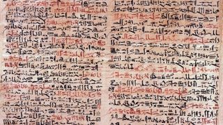 An ancient Egyptian papyrus written in black and red ink.