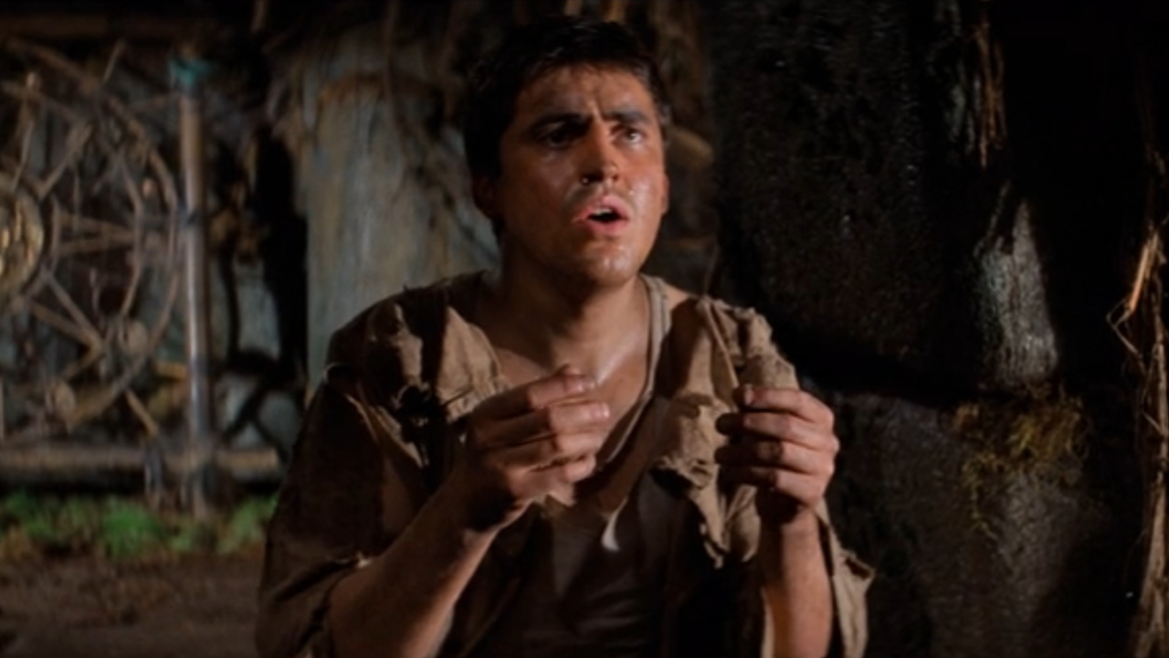 Alfred Molina looking apprehensive in Raiders of the Lost Ark.
