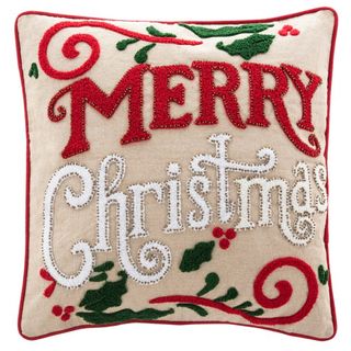 Christmas pillow that says Merry Christmas in red and white i