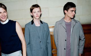 Males modelling blazers and sleeveless top
