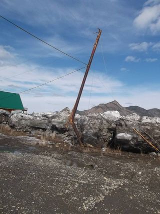 A telephone in Eagle, Alaska, damaged by an ice jam on the Yukon River during the annual ice breakup.