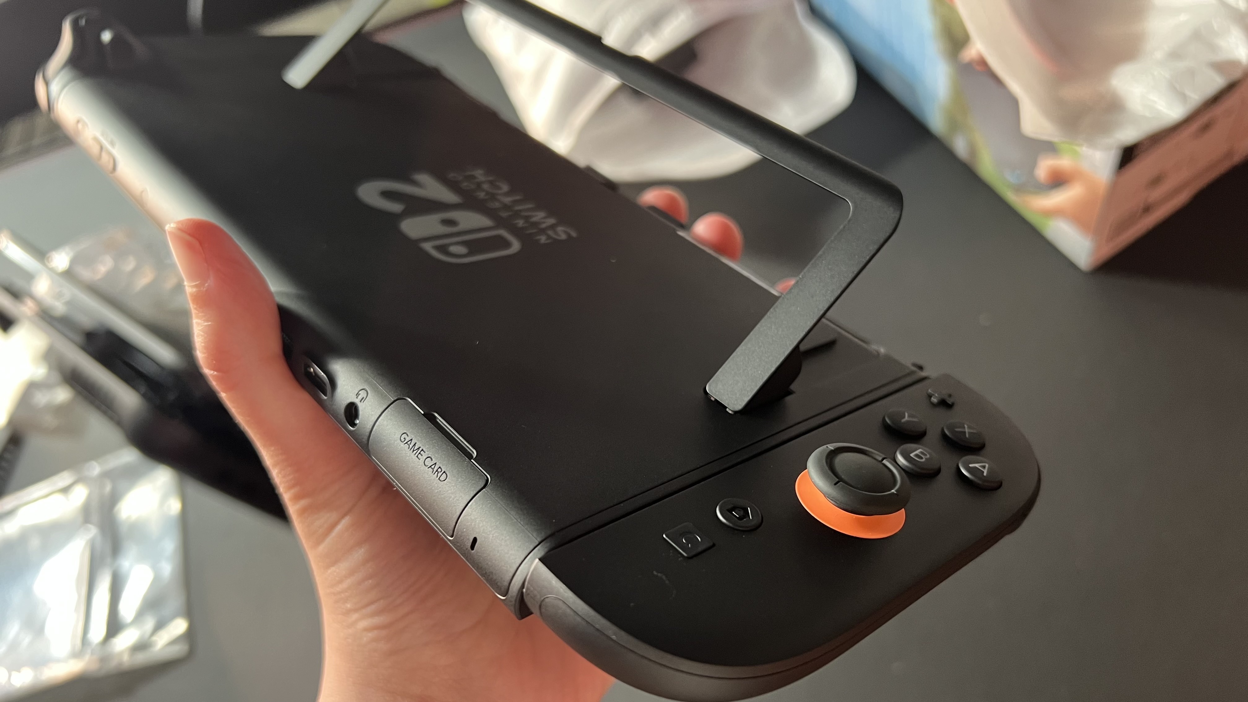 Nintendo Switch 2 with Joy-Con attached backwards and hinge extended