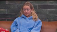 Melody with a shocked reaction in her face.