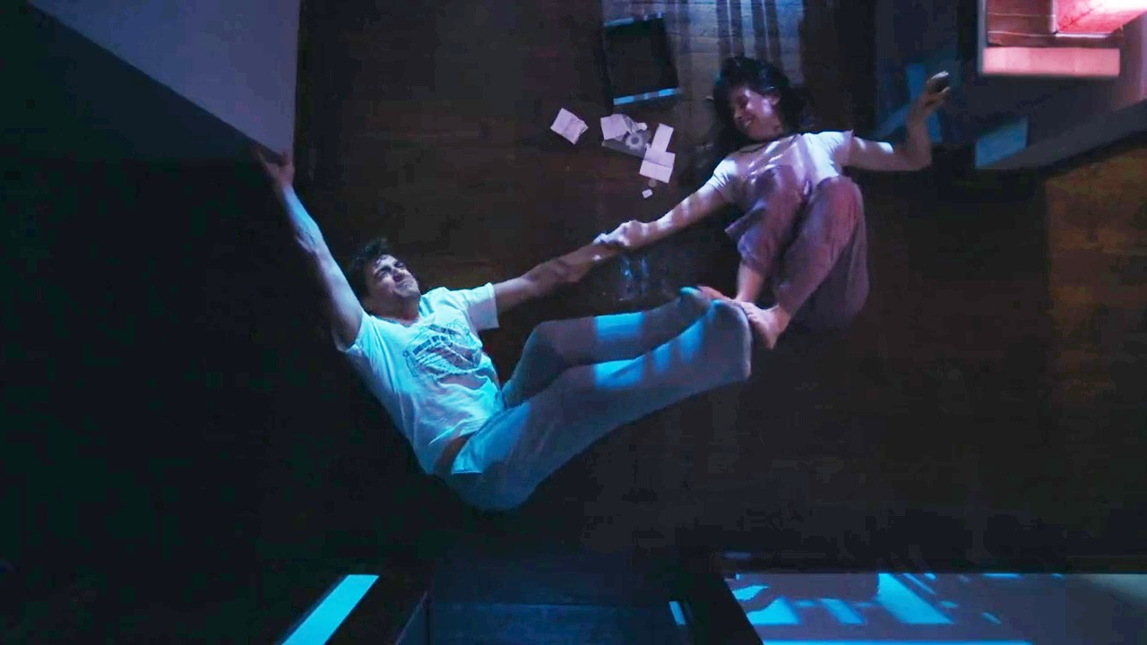 Dave Franco and Alison Brie pushing away from each other in Together.